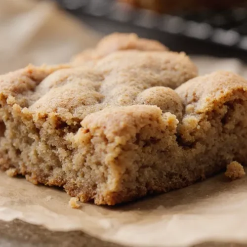 Single snickerdoodle blondie showing soft interior and cinnamon sugar crust